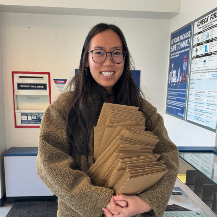 Creator of Little Letter Club drawing at the park