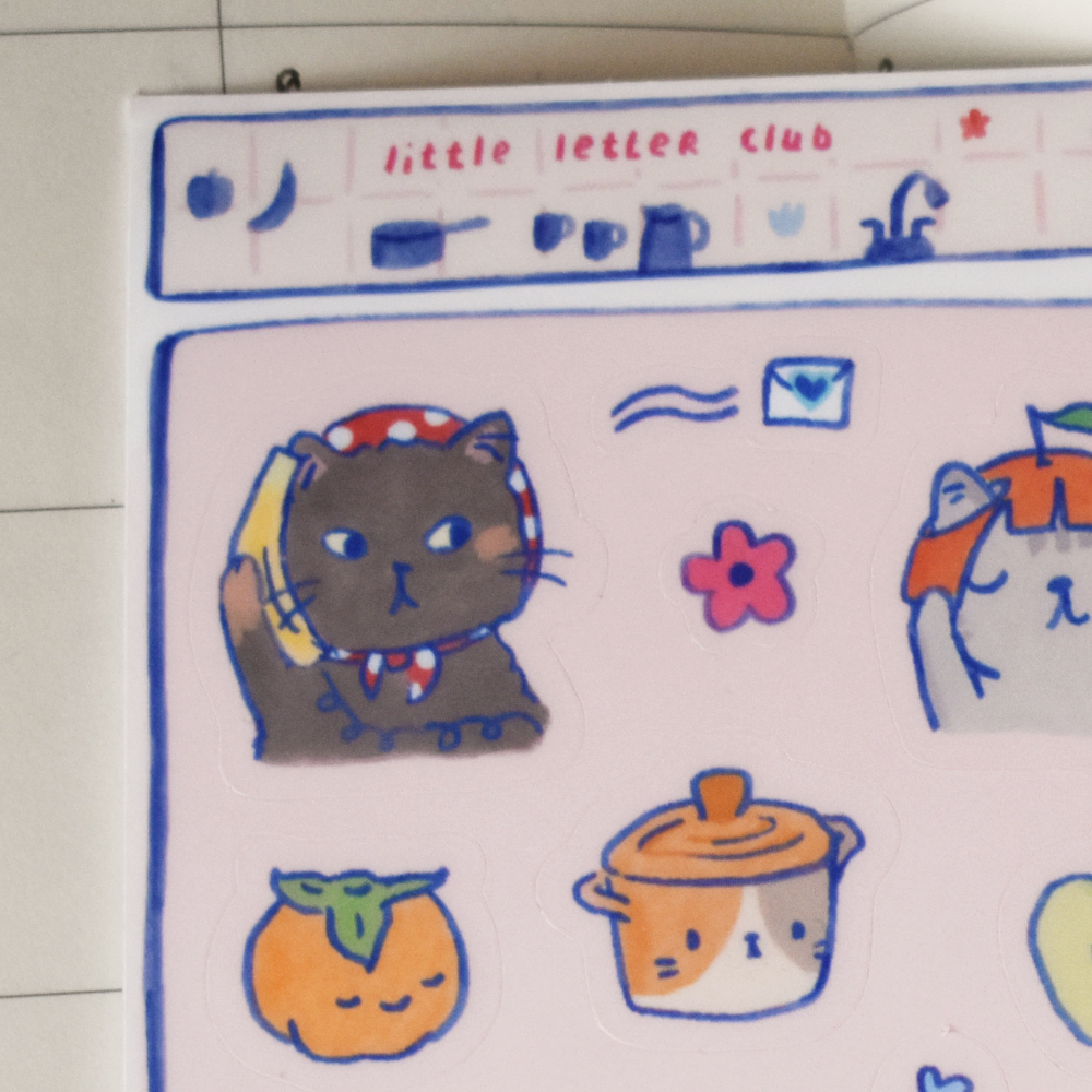 Closeup of stickers featuring cats and other cute characters