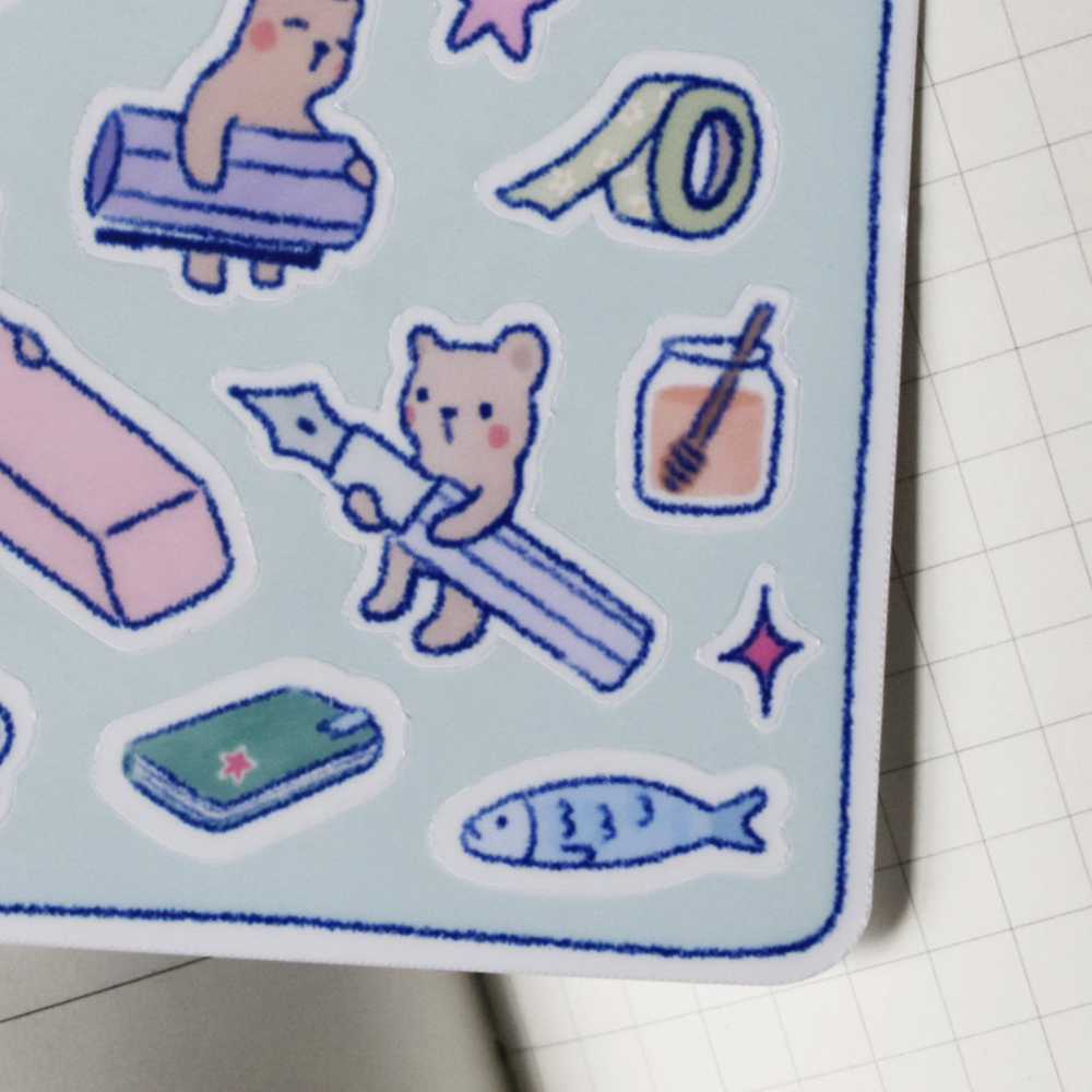 Closeup of stickers featuring cats and other cute characters